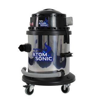 A cylindrical vacuum cleaner labeled "SkyVac Atom Sonic" with a metallic finish, black top, and wheels; hose attached, standing in a neutral setting.