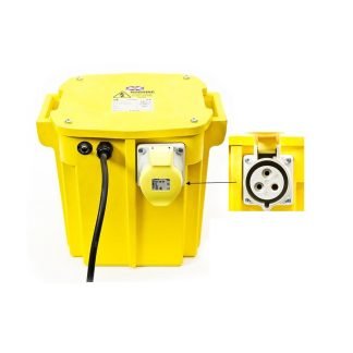 Yellow electrical power transformer with a black cable connected and a close-up of a three-pin socket. Labels and warning signs are visible on the top.